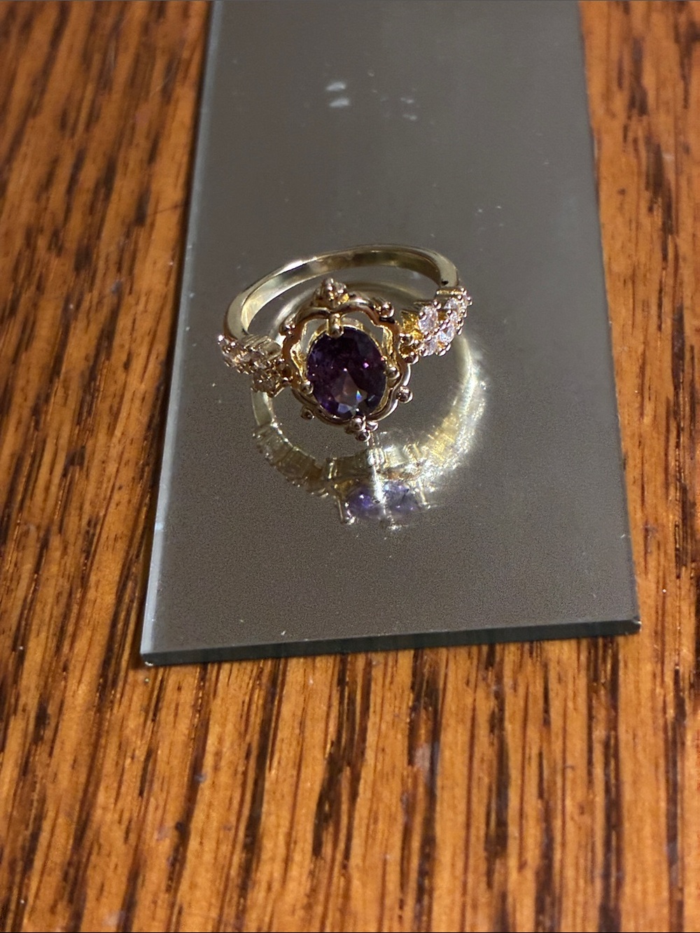 Gold Ring with Purple Gemstone and Accent Stones